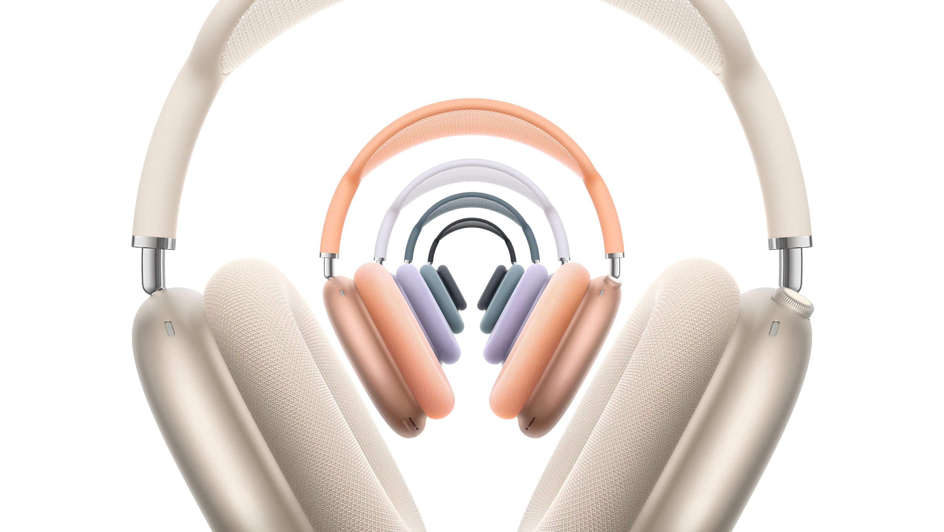 不同颜色的 AirPods Max,分别是星光色、午夜色、蓝色、紫色和橙色。