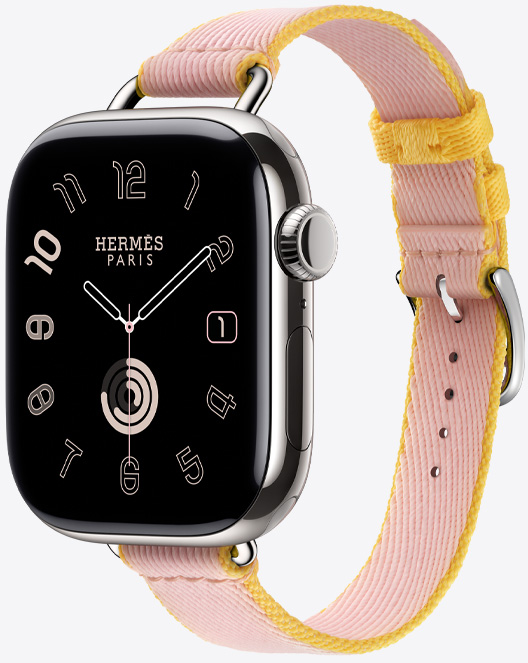 Rose Sakura/Jaune de Naples 樱花粉配那不勒斯黄色 (粉色/黄色系) Twill Jump Attelage Single Tour 表带搭配 Hermès 散射表盘的斜侧视图。